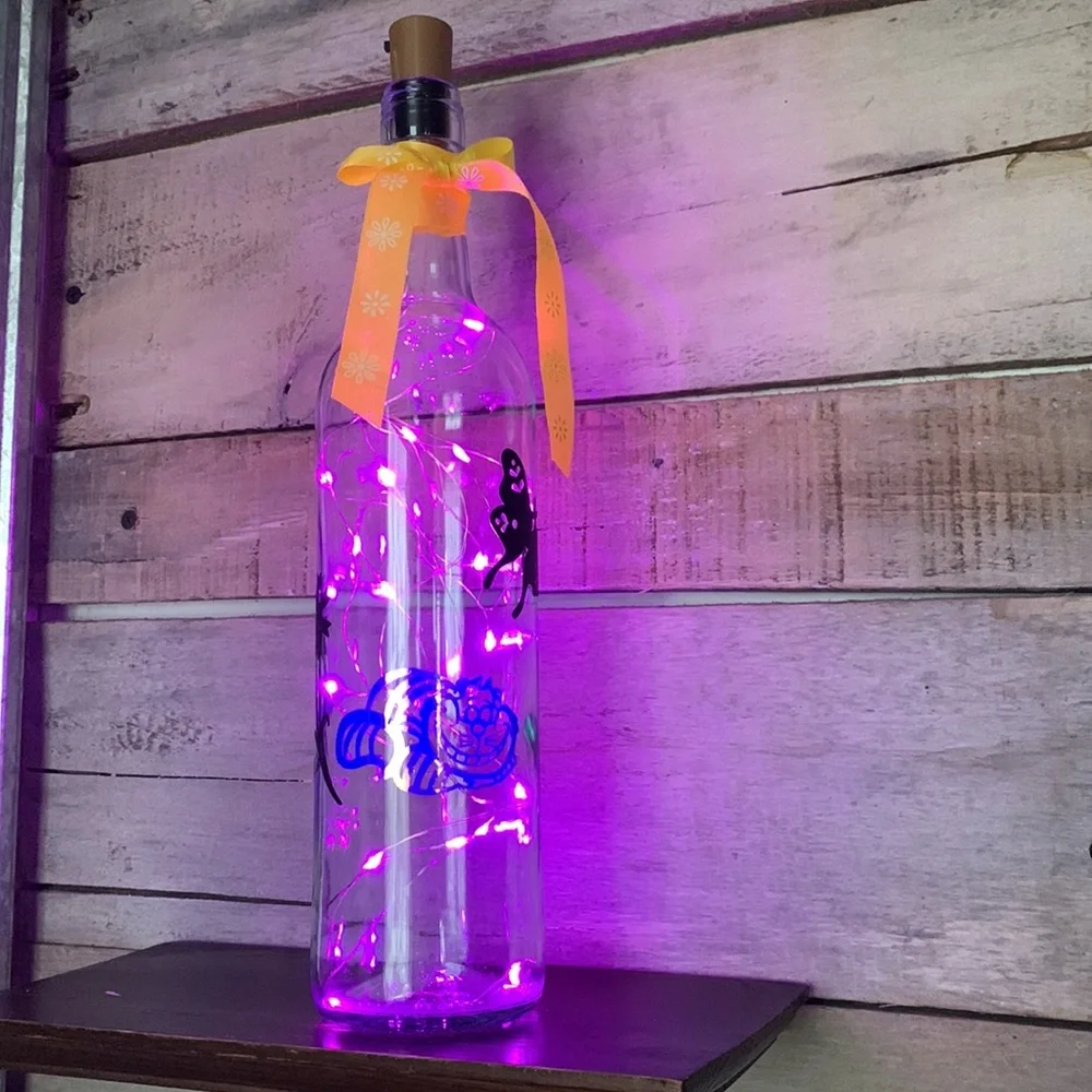 Iridescent Cheshire Cat wine bottle lantern